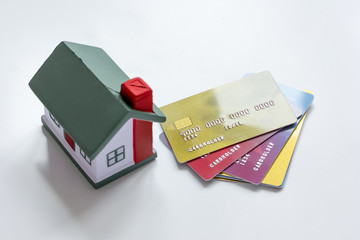credit cards concept mortgag for new home on white background