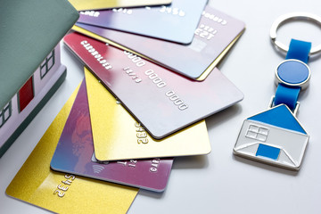 credit cards, key ring - concept mortgage on white background