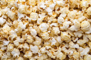 Popcorn background. Caramel sweet corn. Cinema snack.