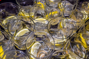 Many alcoholic drinks with lemon