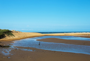  Lagoon and Sand Dune Against Ocean and Blue Sky