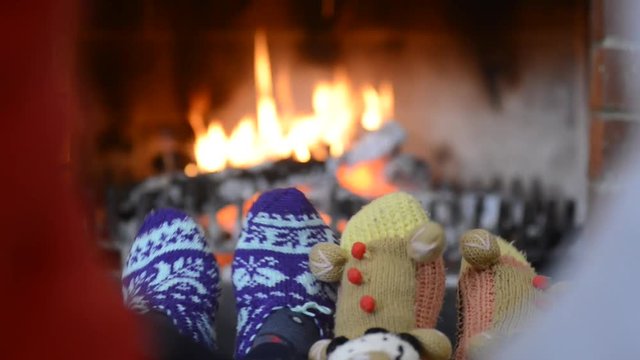 Feet heated on a fireplace