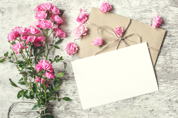 blank white greeting card with pink rose flowers. mock up