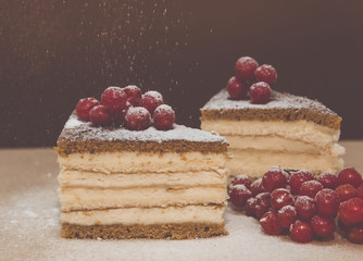 Pieces puff cheesecake decorated with icing sugar