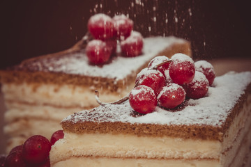 Pieces puff cheesecake decorated with icing sugar