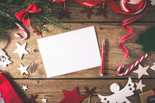 Empty Christmas Card On Wooden Table