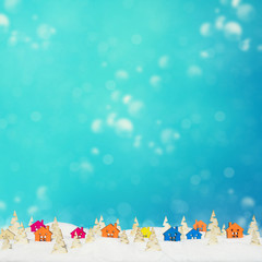 Fototapeta premium Christmas background with small wooden houses, Christmas trees and snow