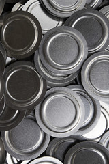 Industrial background. Close up of metal car parts in a warehouse. Stack of new and shiny steel...