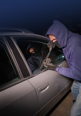 Car thief looking to break into a car