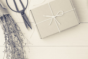 Gift boxes on the white wood,Cardboard boxes tied with string wh