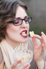 woman eating  sweet candy, toffee caramel