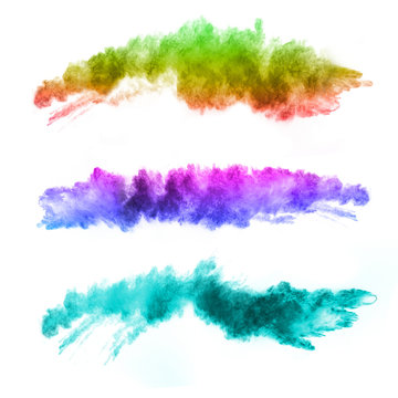 Explosion of colored powders on white background