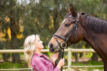 Beautiful elegance back woman cowgirl, riding a horse wearing bl