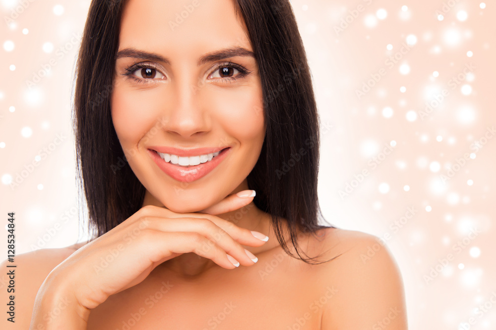 Canvas Prints Pretty young woman touching chin on christmas background