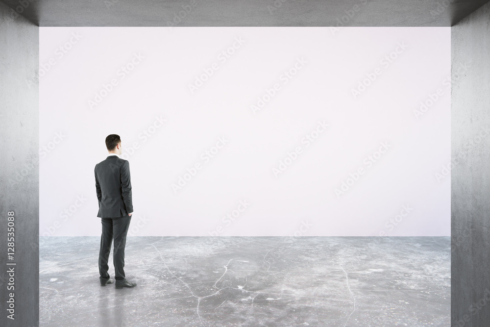 Poster man looking at empty billboard