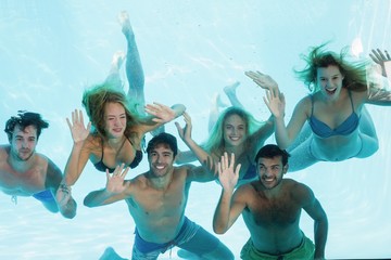 Group of young friends underwater