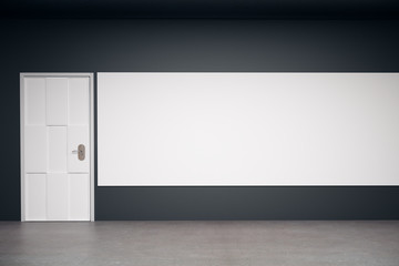 Dark interior with blank billboard