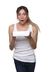 Woman with surprised face holding box. Close up. White background