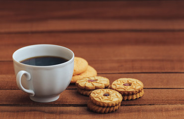 coffee and cookies on wooden background. copy space for text