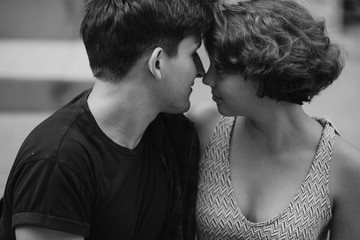 man and woman sitting on the ground