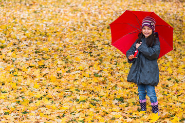 Little girl under umbrella