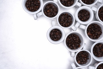 Group of coffee cup with roasted beans top view on metallic grey background
