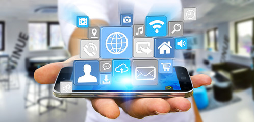 Businessman using modern digital icon application on his mobile