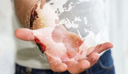 Businessman using digital tactile world interface with his hand