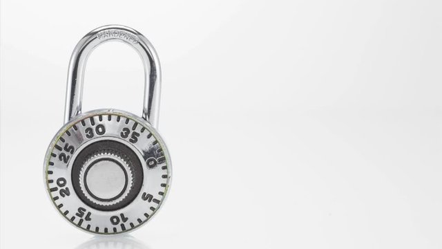 Combination lock opening on white background