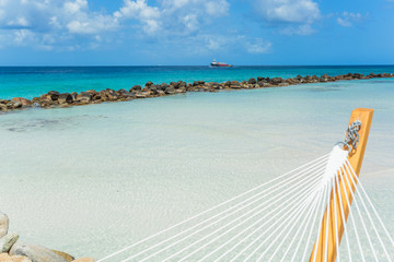 Empty hammock on tropical beach