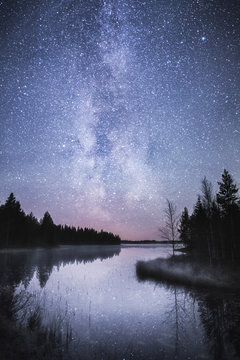 Northern lights reflected on lake, Lapland, Finland, Scandinavia, Europe 