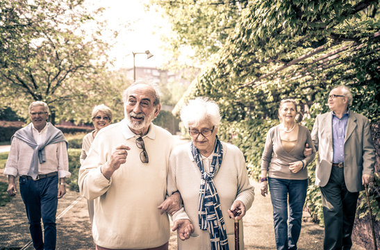 Group Of Old People Walking Outdoor