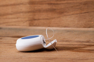 Dental floss isolated on wood board