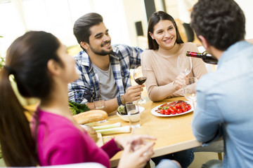 Young people sitting by the table