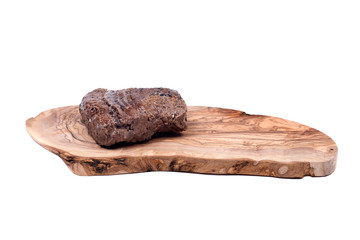 Grass fed juicy corn roast beef on olive wood cutting board isolated on white background