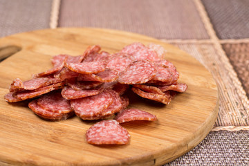 Delicious homemade domestic sausage on the wooden board