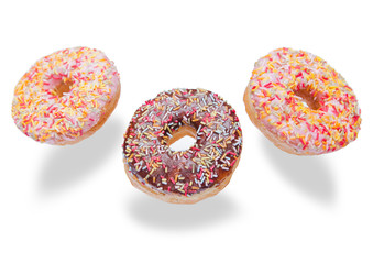 Chocolate and pink donuts in the air for breakfast