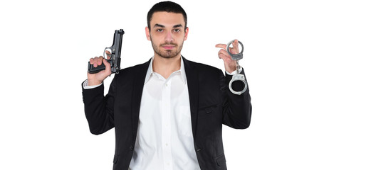  Attractive male holding gun in his hand. Assassin. Police officer. isolated on white