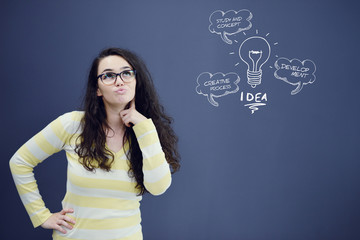 Thinking woman with idea in bubble above looking up isolated on white background