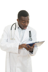 African American doctor shocked and scared by information on a clipboard.