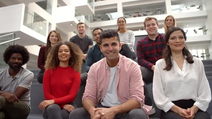 Portrait Of Student Group On Steps Of Campus Building