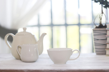 Stock Photo:.Tea set including a teacup, a teapot and a sugar bo