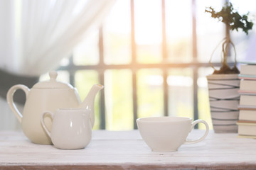 Fototapeta na wymiar Stock Photo:.Tea set including a teacup, a teapot and a sugar bo