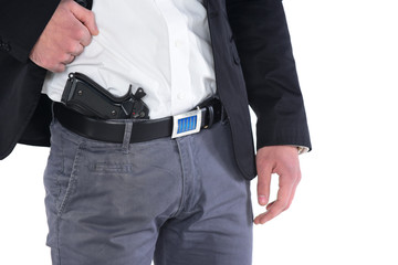  Attractive male holding gun in his hand. Assassin. Police officer. isolated on white