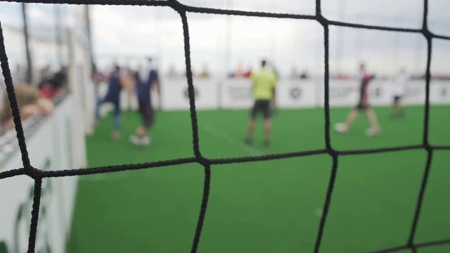 POV of supporter watching amateur teams play soccer game, active lifestyle