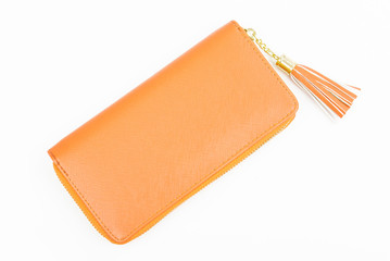 Woman orange purse isolated on the white background. Closeup of modern orange leather wallet over white background. Top view on the wallet.