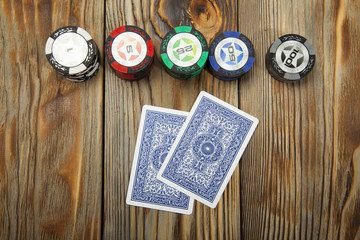 Playing poker on the old wooden table - 128554652