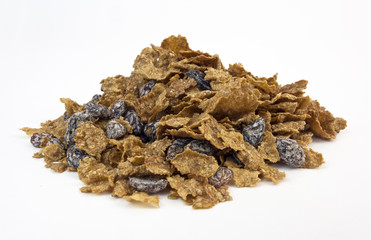 A pile of bran flakes with sugar-coated raisins. Horizontal. 