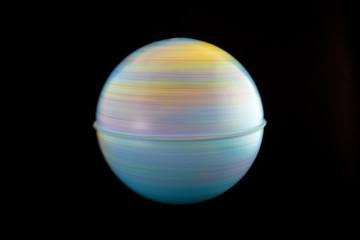 Spinning globe. Black background. Horizontal.