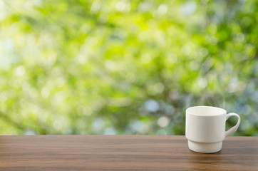 Coffee cup in bokeh background